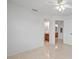 Bedroom with tile floor and access to bathroom at 23465 Harborview Rd # 1021, Punta Gorda, FL 33980