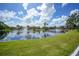 Picturesque pond with bridge and lush greenery at 23465 Harborview Rd # 1021, Punta Gorda, FL 33980