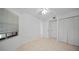 Bedroom with ceiling fan, window, and mirrored closet doors at 23465 Harborview Rd # 1021, Punta Gorda, FL 33980