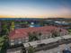 Aerial view of condo building with parking and water view at 23465 Harborview Rd # 1021, Punta Gorda, FL 33980