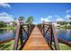 Metal footbridge over a pond, providing access across the tranquil waters at 23465 Harborview Rd # 1021, Punta Gorda, FL 33980