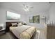 Bedroom with large window and ceiling fan at 23465 Harborview Rd # 1021, Punta Gorda, FL 33980