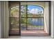 Balcony with sliding glass doors and scenic lake view at 23465 Harborview Rd # 1021, Punta Gorda, FL 33980