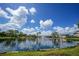 Serene pond with fountain and lush landscaping at 23465 Harborview Rd # 1021, Punta Gorda, FL 33980