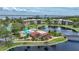 Aerial view of community with lake, tennis courts, and pool at 23465 Harborview Rd # 1021, Punta Gorda, FL 33980