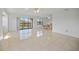 Bright and airy living room with tile floors and balcony access at 23465 Harborview Rd # 1021, Punta Gorda, FL 33980