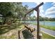 Relaxing swing bench near tennis courts, ideal for community enjoyment at 23465 Harborview Rd # 1021, Punta Gorda, FL 33980