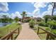 Community clubhouse with a walkway, offering a welcoming atmosphere at 23465 Harborview Rd # 1021, Punta Gorda, FL 33980