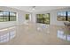 Bright living room with tile floors and sliding glass doors at 23465 Harborview Rd # 1021, Punta Gorda, FL 33980