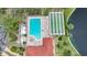 Aerial view of community pool, shuffleboard, and lake at 23465 Harborview Rd # 1021, Punta Gorda, FL 33980
