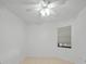 Bright bedroom with ceiling fan and window coverings at 23465 Harborview Rd # 1021, Punta Gorda, FL 33980