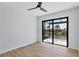 Bright bedroom with sliding glass doors opening to a view of the water at 8356 Tecumseh Cir, Port Charlotte, FL 33981