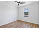 Spacious bedroom with wood-like tile floors and a large window at 8356 Tecumseh Cir, Port Charlotte, FL 33981