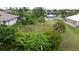 Waterfront vacant lot, surrounded by established homes and lush landscaping at 8356 Tecumseh Cir, Port Charlotte, FL 33981