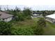 Spacious vacant lot with canal views and neighboring houses at 8356 Tecumseh Cir, Port Charlotte, FL 33981