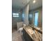 Elegant bathroom with granite vanity, walk-in shower, and modern fixtures at 8356 Tecumseh Cir, Port Charlotte, FL 33981