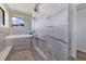 Luxury bathroom with walk-in shower, built-in bench and modern tile at 8356 Tecumseh Cir, Port Charlotte, FL 33981