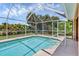 Refreshing screened pool with steps for easy access at 163 Jennifer Dr, Rotonda West, FL 33947