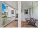 Relaxing porch with a swing overlooking the water at 13310 Anglers Way, Placida, FL 33946