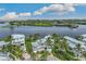 Waterfront property aerial view, showcasing the home and surrounding area at 13310 Anglers Way, Placida, FL 33946