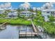 Elevated view of waterfront home showcasing private dock and boat at 13310 Anglers Way, Placida, FL 33946