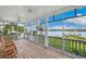 Relaxing screened porch with rocking chairs overlooks the water at 13310 Anglers Way, Placida, FL 33946