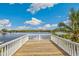 Private deck with white railings offering scenic water views at 13310 Anglers Way, Placida, FL 33946