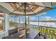 Outdoor patio with a dining table, offering water views at 13310 Anglers Way, Placida, FL 33946
