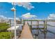 Private dock with boat lift and scenic waterway views at 13310 Anglers Way, Placida, FL 33946