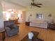 Spacious living room with hardwood floors and ample natural light at 6207 Oriole Blvd, Englewood, FL 34224