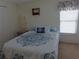 Well-lit bedroom with a double bed and large closet at 6207 Oriole Blvd, Englewood, FL 34224