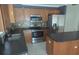 Kitchen with wood cabinets and stainless steel appliances at 2332 Potomac Mark Pl, Ruskin, FL 33570