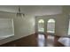 Bright dining room with hardwood floors and large windows at 2332 Potomac Mark Pl, Ruskin, FL 33570
