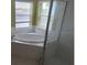 Bathroom with corner bathtub and shower at 2332 Potomac Mark Pl, Ruskin, FL 33570