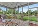 Relaxing screened porch overlooking a tranquil lake at 3255 Village Ln, Port Charlotte, FL 33953