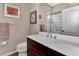 Clean bathroom with vanity, toilet and shower at 27453 Hole In One Pl, Englewood, FL 34223