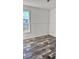 Spacious bedroom with wood-look floors and window at 1377 Ibis Dr, Englewood, FL 34224