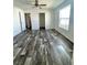 Bedroom featuring plank flooring and neutral colored walls at 1377 Ibis Dr, Englewood, FL 34224
