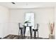 Cozy dining area featuring modern table and chairs set against a bright, neutral backdrop at 1377 Ibis Dr, Englewood, FL 34224