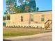 Charming single story home featuring meticulously kept lawn and a lovely covered porch at 1377 Ibis Dr, Englewood, FL 34224