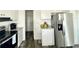 Modern kitchen with stainless steel appliances and bright cabinets at 1377 Ibis Dr, Englewood, FL 34224