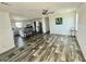 Bright, open-concept living room with modern flooring and neutral color palette at 1377 Ibis Dr, Englewood, FL 34224