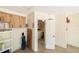 Spacious garage with storage cabinets and washer-dryer hookups at 3440 Downing W St, Englewood, FL 34224