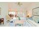 Inviting living room featuring tile floors, neutral decor, and a view of the entryway at 3440 Downing W St, Englewood, FL 34224
