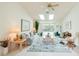 Bright living room with tile flooring, ceiling fan, and sliding glass doors to the pool at 3440 Downing W St, Englewood, FL 34224