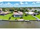 Aerial view of waterfront home with pool and dock at 42 Waterford Dr, Englewood, FL 34223