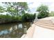 Steps leading to private boat dock on tranquil waterway at 3440 Downing W St, Englewood, FL 34224