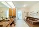 Bathroom with double vanity and walk-in shower at 3440 Downing W St, Englewood, FL 34224