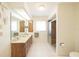 Updated bathroom features a large vanity, shower, and tile flooring at 3440 Downing W St, Englewood, FL 34224