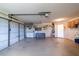 Spacious two-car garage with ample storage and workshop area at 3440 Downing W St, Englewood, FL 34224